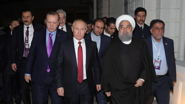 Владимир Путин, президент Ирана Хасан Роухани и президент Турции Реджеп Тайип Эрдоган после совместного заявления для прессы по итогам встречи. 22 ноября 2017