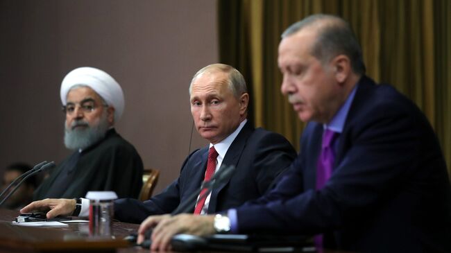 Президент России Владимир Путин, президент Ирана Хасан Рухани и президент Турции Реджеп Тайип Эрдоган