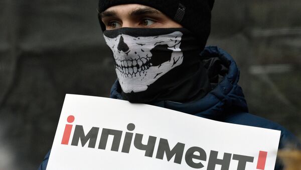 Участник акции протеста Марш за импичмент в Киеве. 3 декабря 2017