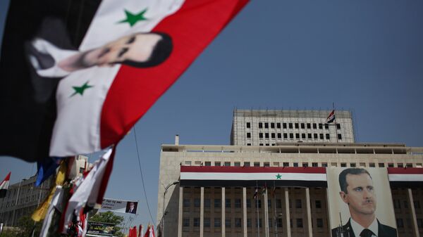 Портрет президента Башара Асада в Дамаске