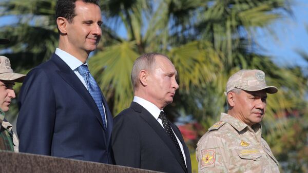 Владимир Путин, президент Сирийской Арабской Республики Башар Асад и министр обороны России Сергей Шойгу в Сирии