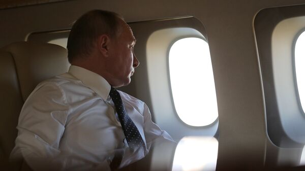 Президент РФ Владимир Путин на борту президентского самолета