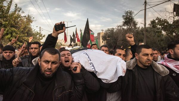 Похороны местного жителя в секторе Газа, погибшего в результате обстрела. 12 декабря 2017