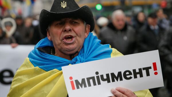 Участник митинга сторонников Михаила Саакашвили в центре Киева за принятие закона об импичменте украинского президента Петра Порошенко. 17 декабря 2017