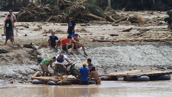 Последствия наводнения в Сальвадоре, на юге Филиппин. 23 декабря 2017