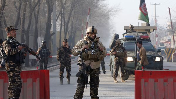 Афганские силы безопасности на контрольно-пропускным пункте рядом с комплексом национального разведывательного агентства Афганистана в Кабуле. 25 декабря 2017