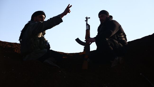 Турецкие боевики из Свободной сирийской армии занимают позицию в районе Тал Малид, к северу от Алеппо. 20 января 2018