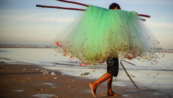 Рыбак на берегу деревни Ке Га во Вьетнаме