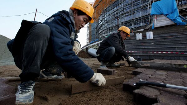 Рабочие из КНДР на строительстве в России. Архивное фото