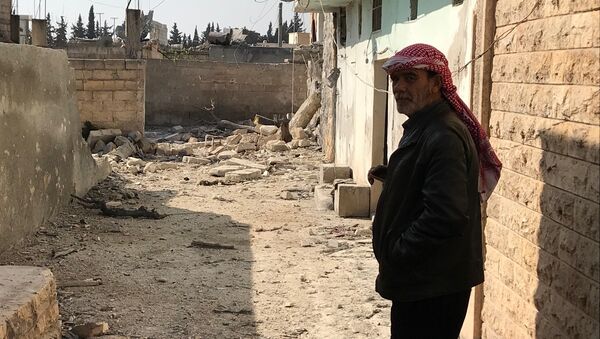 Последствия обстрела турецкими военными поселения Дженджерес в кантоне Африн на севере Сирии