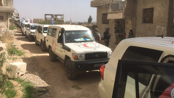 Гуманитарный конвой Красного полумесяца в Восточной Гуте, Сирия. 5 марта 2018 