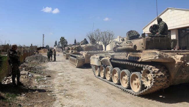 Военнослужащие сирийской армии в одном из освобожденных районов Восточной Гуты. Архивное фото