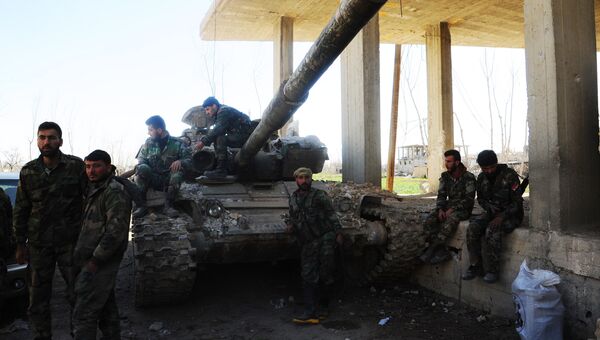 Военнослужащие сирийской армии в одном из освобожденных районов Восточной Гуты. 12 марта 2018
