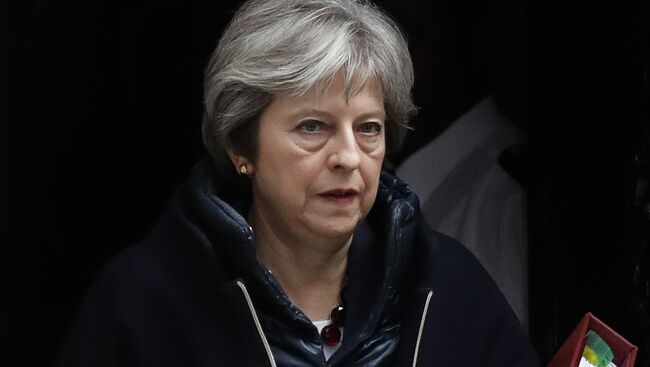 Премьер-министр Великобритании Тереза Мэй перед еженедельной сессией Совета министров в парламенте в Лондоне. 14 марта 2018