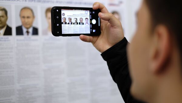Участники выборов президента Российской Федерации избирательном участке. 18 марта 2018