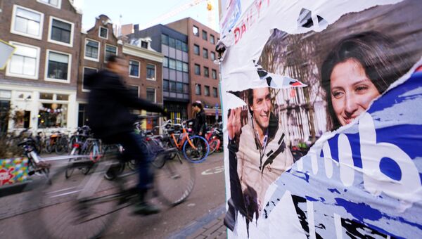 Предвыборный плакат на улице Амстердама в Нидерландах. 21 марта 2018