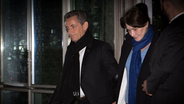 Экс-президент Франции Николя Саркози  выходит из офиса французского телевидения TF1 после выступления в вечерних новостях. 22 марта 2018