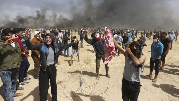 Палестинские протестующие на границе сектора Газа и Израиля. Архивное фото