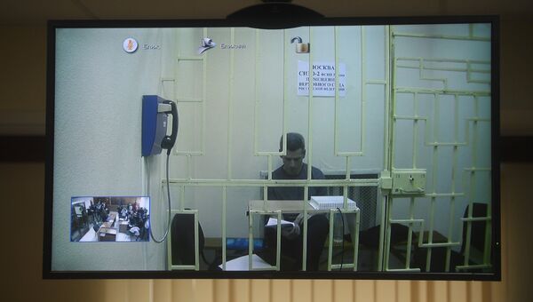 Совладелец и председатель совета директоров группы Сумма Зиявудин Магомедов во время видеоконференцсвязи в зале Московского городского суда. 16 апреля 2018