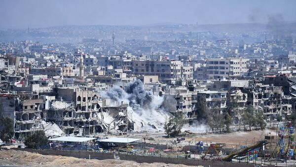 Разрушенные дома в районе лагеря беженцев Ярмук на юге Дамаска. Архивное фото