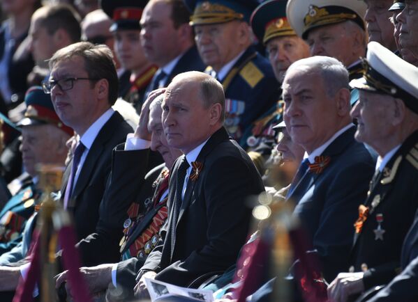 Президент России Владимир Путин во время военного парада в ознаменование 73-й годовщины Победы в Великой Отечественной войне 1941–1945 годов на Красной площади в Москве. 9 мая 2018