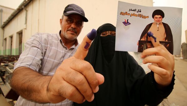 Проголосовавшие на избирательном участке во время парламентских выборов в Ираке. 12 мая 2018