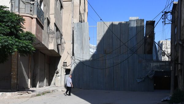 Ситуация в районе лагеря беженцев Ярмук в южном пригороде Дамаска. Архивное фото