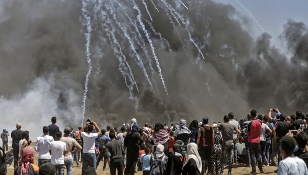Столкновения палестинцев и израильских военных на границе сектора Газа с Израилем. 14 мая 2018 года