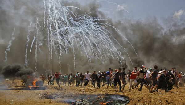Столкновения палестинцев и израильских военных на границе сектора Газа с Израилем