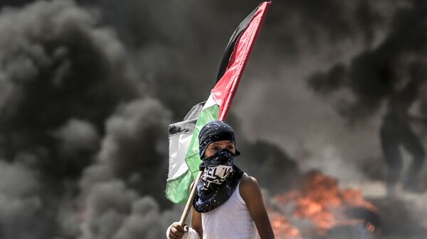 Столкновения палестинцев и израильских военных на границе сектора Газа с Израилем. Архивное фото