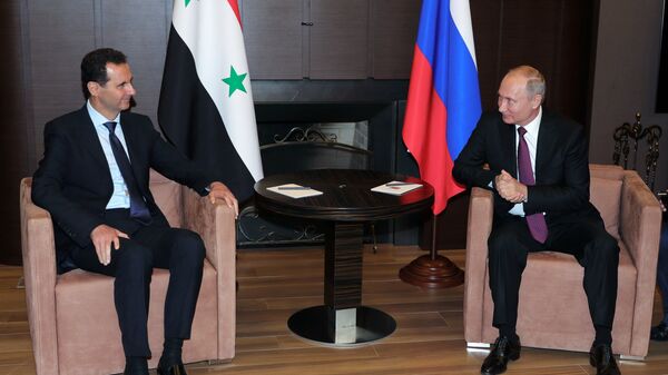 Президент России Владимир Путин и президент Сирийской Арабской Республики Башар Асад во время встречи