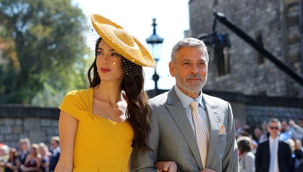 Амаль Клуни и американский актер Джордж Клуни прибывают на свадебную церемонию британского принца Гарри, герцога Сассекса и актрисы США Меган Маркл