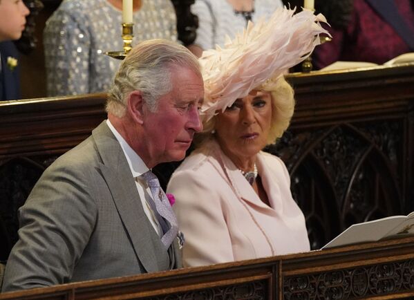 Принц Чарльз с супругой Камиллой во время свадебной церемонии в часовне Св. Георгия в Виндзорском замке недалеко от Лондона, Англия. 19 мая 2018