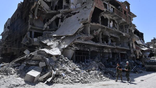 Разрушенные дома в освобожденном лагере палестинских беженцев Ярмук на юге Дамаска
