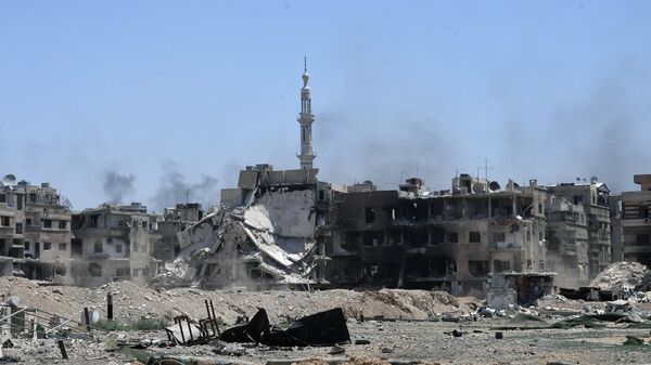 Разрушенные дома в освобожденном лагере палестинских беженцев Ярмук на юге Дамаска. Архивное фото
