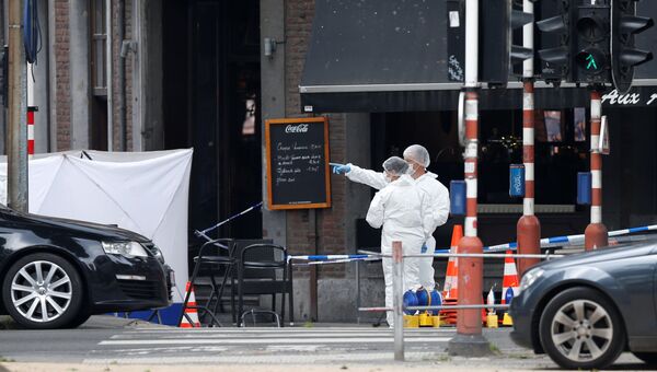 Эксперты по судебной экспертизе на месте стрельбы в городе Льеж, Бельгия. 29 мая 2018