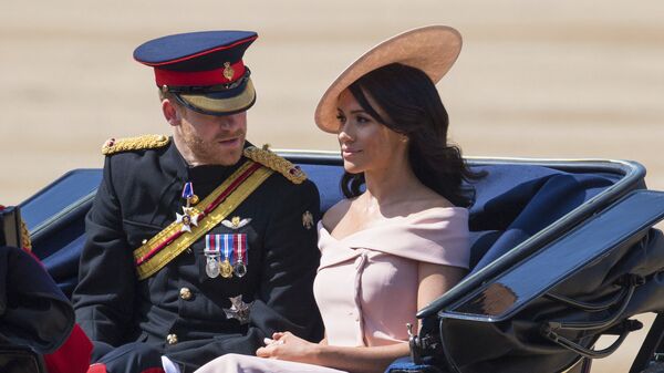 Принц Гарри с женой Меган Маркл на параде Trooping of the Colour по случаю официального дня рождения королевы Елизаветы II. 9 июня 2018