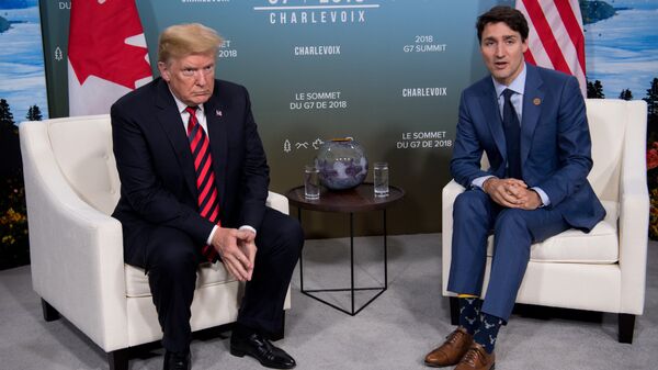 Президент США Дональд Трамп и премьер-министр Канады Джастин Трюдо на саммите G7 в Ла-Мальбие, Квебек, Канада. 8 июня 2018