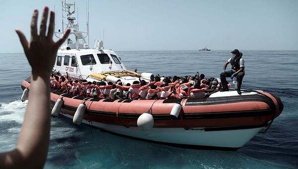 Мигранты, спасенные судном Aquarius в Средиземном море. 12 июня 2018