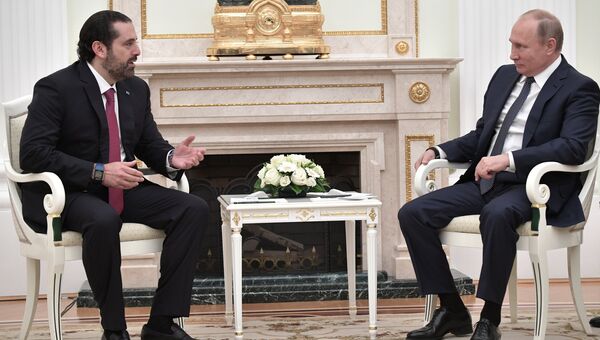 Президент РФ Владимир Путин и премьер-министр Ливана Саад Харири во время встречи. 13 июня 2018