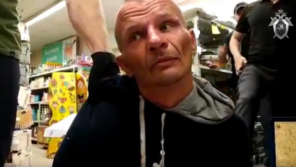 Мужчина, захвативший заложницу в магазине Дикси в Москве. 1 июля 2018