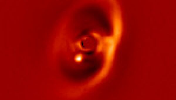Фотография новорожденной планеты  PDS 70b в созвездии Центавра