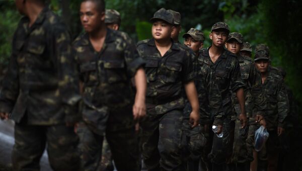 Тайские солдаты около пещеры Тхам Луанг во время операции по спасению 12 мальчиков и их тренера. Архивное фото