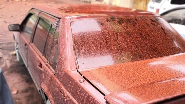 Последствия красного дождя на парковке в Норильске. 3 июля 2018