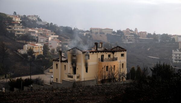 Последствия пожара в Неос-Вутсасе в Греции. 24 июля 2018