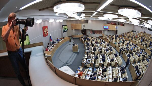 Фоторепортер на пленарном заседании Государственной Думы РФ