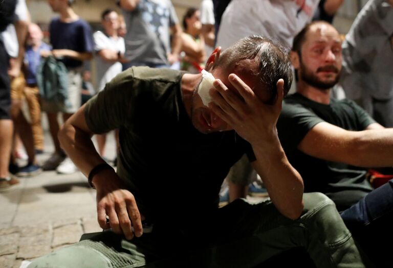 Во время столкновений с полицейскими на акции протеста против изменений судебной системы в Варшаве. 26 июля 2018