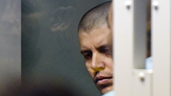 Член банды GTA Хазратхон Додохонов, обвиняемый в серии убийств водителей в Мособлсуде во время оглашения приговора. Архивное фото