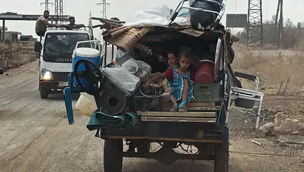 Дети в автомобиле на юго-западе сирийской провинции Дераа. Архивное фото