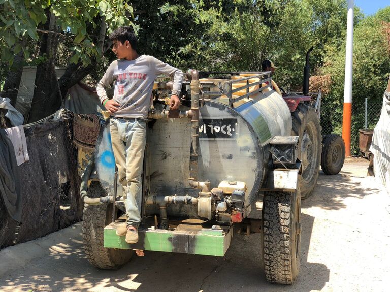 Сирийские беженцы в палаточном лагере в центральном Бекаа в поселении Каб Эльяс. 11 августа 2018 Сирийские беженцы в палаточном лагере в центральном Бекаа в поселении Каб Эльяс. 11 августа 2018